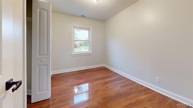8803 Dena Dr, Henrico, VA 23229 - unfurnished bedroom featuring wood finished floors and baseboards