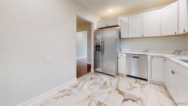 8803 Dena Dr, Henrico, VA 23229 - kitchen with stainless steel appliances, baseboards, white cabinetry, recessed lighting, and light stone countertops