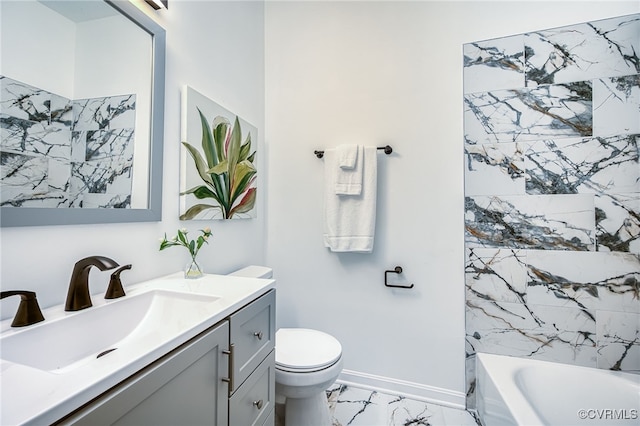 208 E 18th St, Richmond, VA 23224 - bathroom featuring marble look tile flooring, toilet, vanity, baseboards, and shower / washtub combination