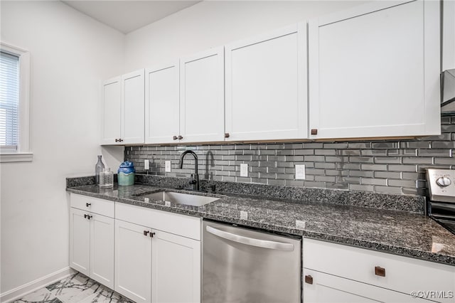 208 E 18th St, Richmond, VA 23224 - kitchen featuring stainless steel dishwasher, a sink, light marble finish flooring, baseboards, and white cabinets