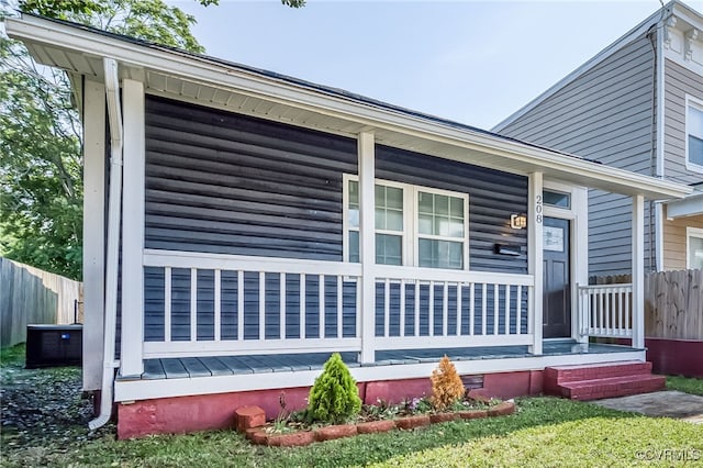 208 E 18th St, Richmond, VA 23224 - view of side of property featuring covered porch, fence, and central AC unit