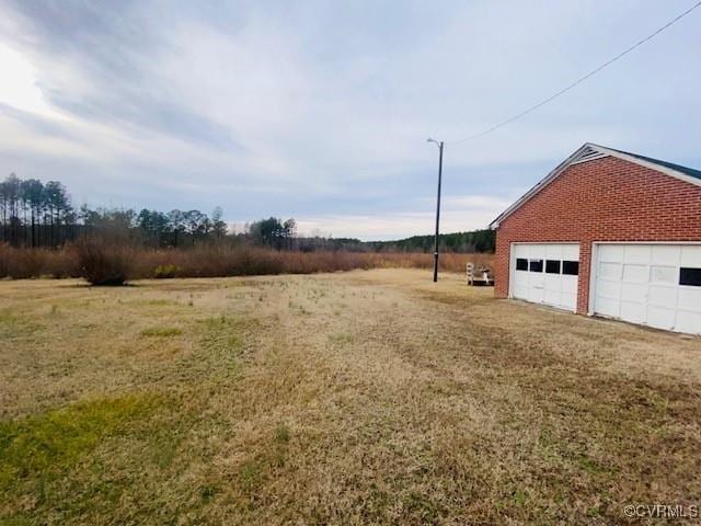 5939 Dry Bread Rd, Emporia, VA 23847 - view of yard with a detached garage and an outdoor structure
