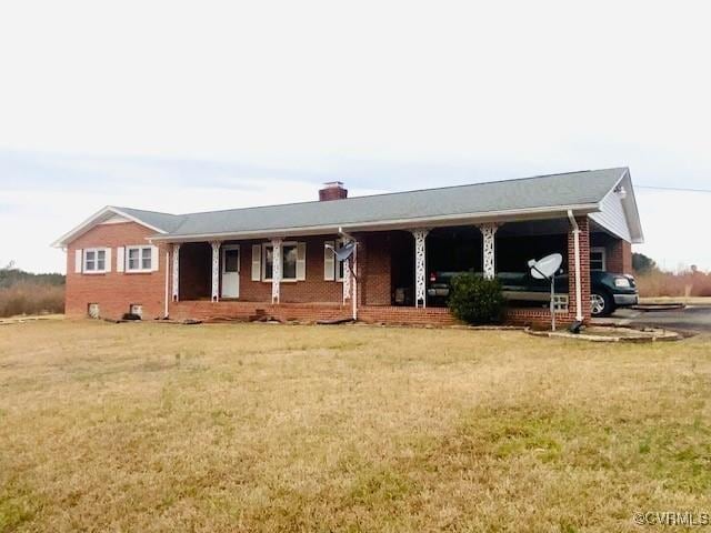 5939 Dry Bread Rd, Emporia, VA 23847 - single story home featuring a porch, a chimney, a front yard, and brick siding
