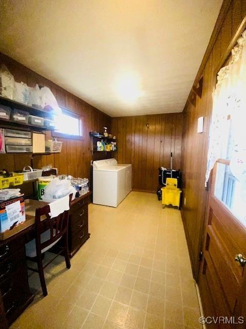 5939 Dry Bread Rd, Emporia, VA 23847 - office area featuring washer / dryer, wood walls, and light flooring
