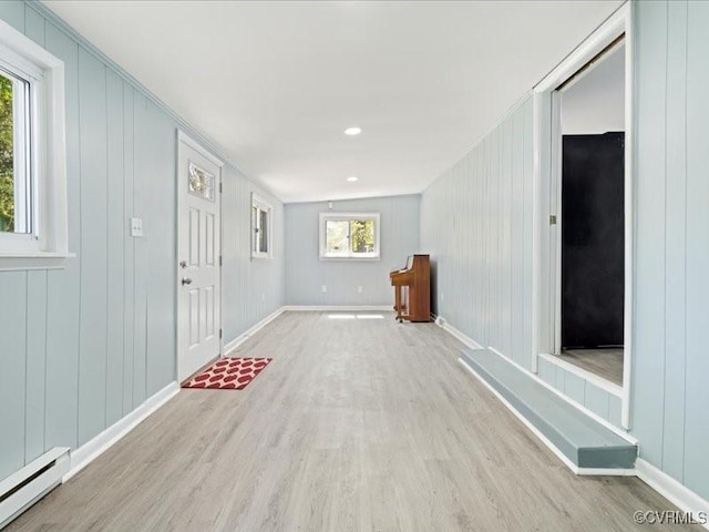 2519 Deerfield Dr, Petersburg, VA 23805 - spare room featuring baseboard heating, wood finished floors, baseboards, and a decorative wall