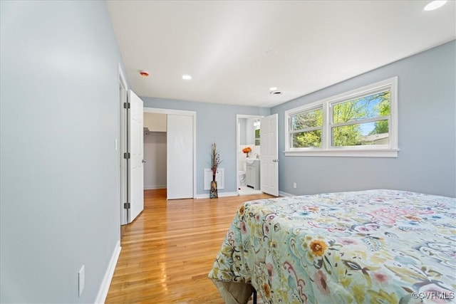 2519 Deerfield Dr, Petersburg, VA 23805 - bedroom featuring light wood finished floors, baseboards, recessed lighting, and ensuite bath