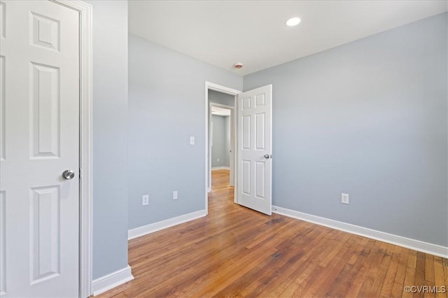 2519 Deerfield Dr, Petersburg, VA 23805 - unfurnished bedroom with baseboards, wood finished floors, and recessed lighting