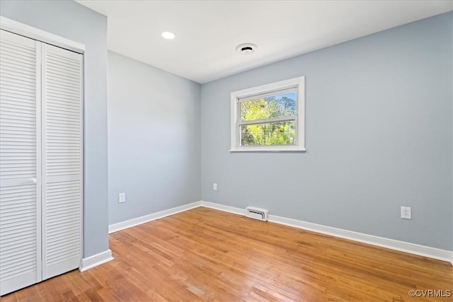 2519 Deerfield Dr, Petersburg, VA 23805 - unfurnished bedroom featuring baseboards, a closet, light wood-style flooring, and recessed lighting