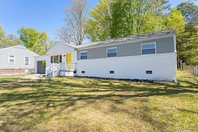 2519 Deerfield Dr, Petersburg, VA 23805 - back of property with crawl space and a lawn
