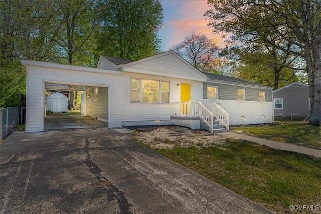 2519 Deerfield Dr, Petersburg, VA 23805 - ranch-style house featuring a storage unit, asphalt driveway, crawl space, an outdoor structure, and an attached carport