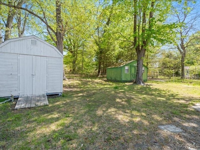 2519 Deerfield Dr, Petersburg, VA 23805 - view of yard featuring a storage shed and an outbuilding