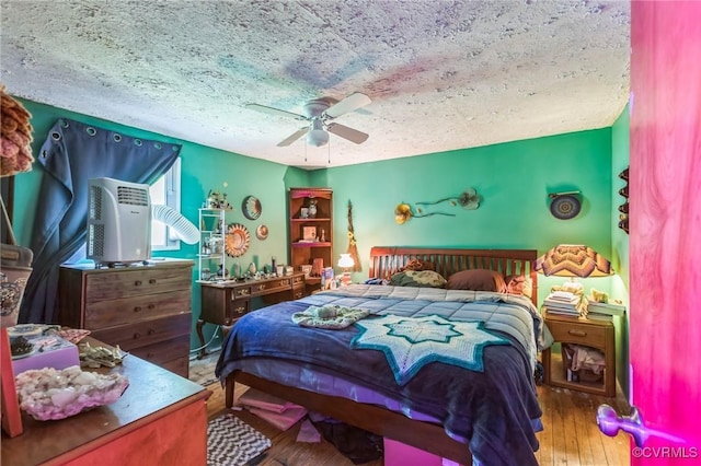 2003 Sweet Hollow Rd, Big Island, VA 24523 - bedroom with a textured ceiling, hardwood / wood-style floors, and ceiling fan
