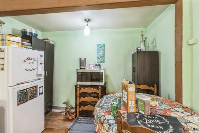 2003 Sweet Hollow Rd, Big Island, VA 24523 - kitchen featuring freestanding refrigerator, stainless steel microwave, and wood finished floors