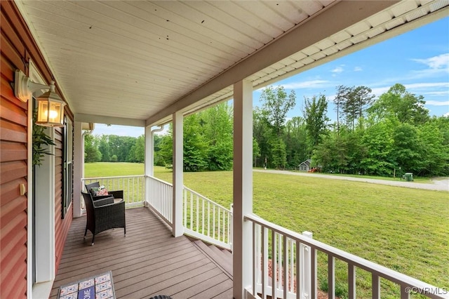 5239 Old Buckingham Rd, Powhatan, VA 23139 - deck with a porch, a lawn, and view of scattered trees