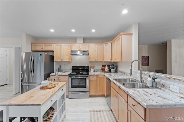 5239 Old Buckingham Rd, Powhatan, VA 23139 - kitchen with appliances with stainless steel finishes, under cabinet range hood, light brown cabinets, a sink, and recessed lighting