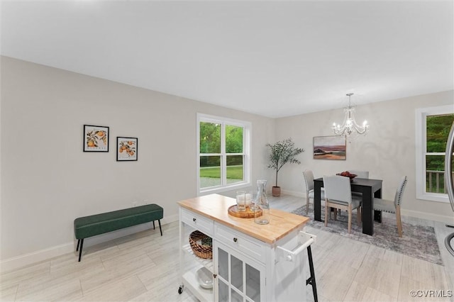 5239 Old Buckingham Rd, Powhatan, VA 23139 - dining room with a chandelier, healthy amount of natural light, and baseboards