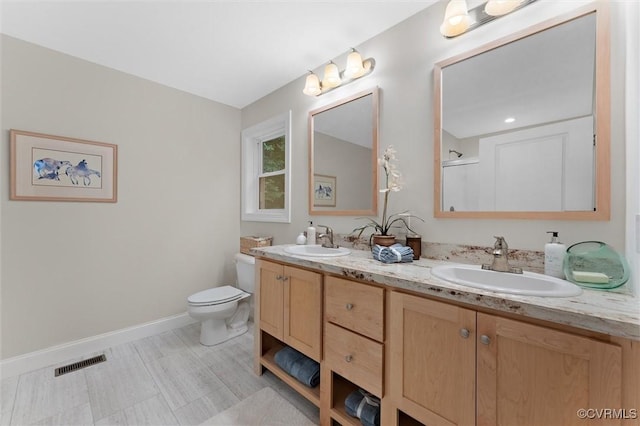5239 Old Buckingham Rd, Powhatan, VA 23139 - full bath featuring double vanity, baseboards, and toilet
