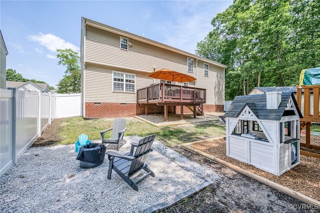 7107 Dortonway Pl, Chesterfield, VA 23832 - rear view of house with a wooden deck, crawl space, fence, and a fire pit