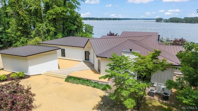 1665 Wilton Creek Rd, Hartfield, VA 23071 - view of front of property with a standing seam roof, metal roof, a water view, and central air condition unit