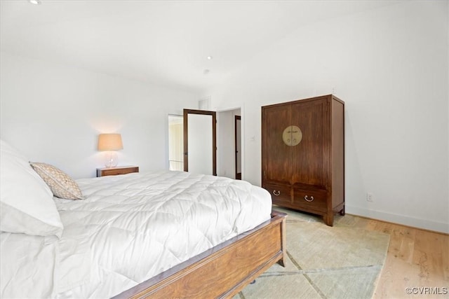 1665 Wilton Creek Rd, Hartfield, VA 23071 - bedroom with wood finished floors and vaulted ceiling