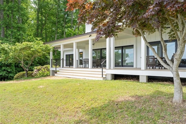 1665 Wilton Creek Rd, Hartfield, VA 23071 - back of property featuring a yard, board and batten siding, and a porch