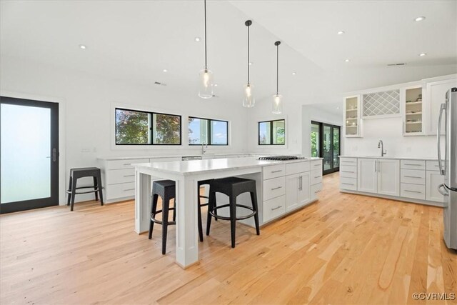 1665 Wilton Creek Rd, Hartfield, VA 23071 - kitchen with a sink, gas stovetop, light countertops, light wood finished floors, and recessed lighting