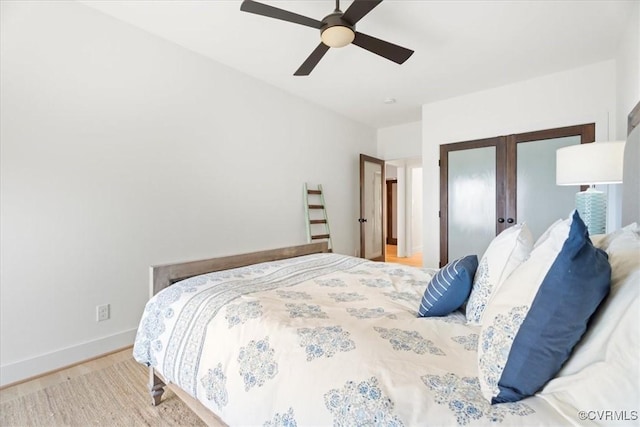 1665 Wilton Creek Rd, Hartfield, VA 23071 - bedroom featuring french doors, wood finished floors, baseboards, a ceiling fan, and a closet