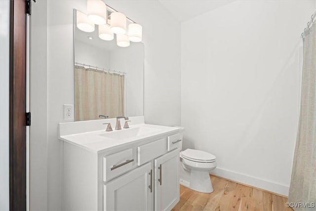 1665 Wilton Creek Rd, Hartfield, VA 23071 - full bath with vanity, wood finished floors, and toilet