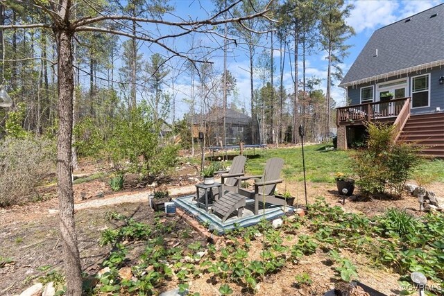 41 Pine Shadow Ct, Troy, VA 22974 - view of yard with a trampoline, a deck, and stairs