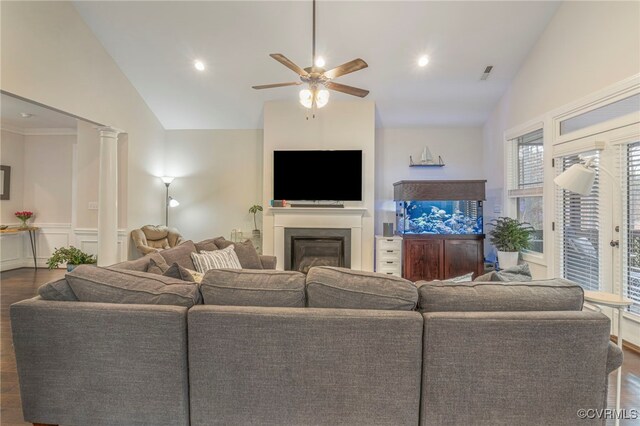 41 Pine Shadow Ct, Troy, VA 22974 - living room with lofted ceiling, dark wood-style floors, a ceiling fan, a glass covered fireplace, and wainscoting