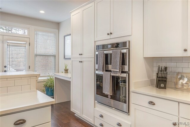 41 Pine Shadow Ct, Troy, VA 22974 - kitchen featuring double oven, decorative backsplash, white cabinets, dark wood finished floors, and light countertops