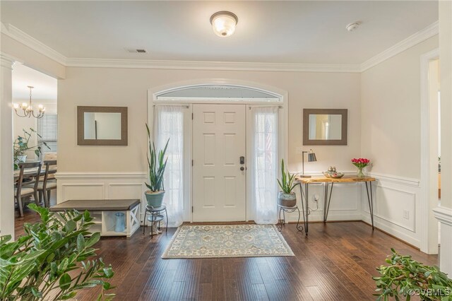 41 Pine Shadow Ct, Troy, VA 22974 - foyer featuring ornamental molding, a chandelier, a decorative wall, dark wood-type flooring, and wainscoting