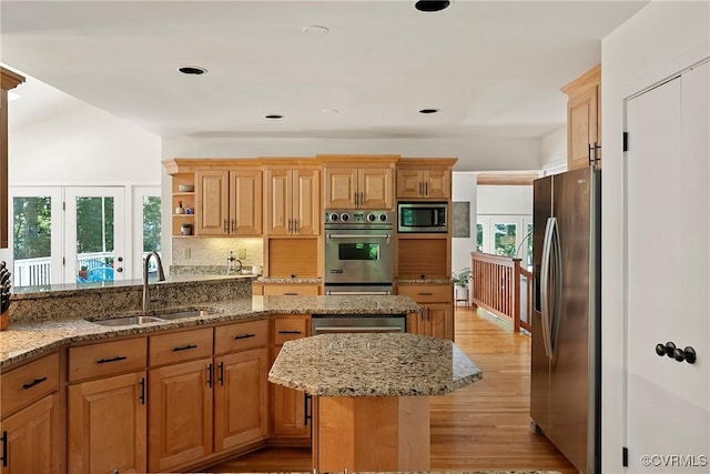 13700 Harbourwood Rd, Midlothian, VA 23112 - kitchen with stainless steel appliances, a sink, a center island, light stone counters, and recessed lighting