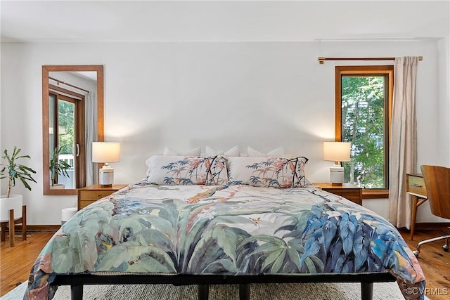 13700 Harbourwood Rd, Midlothian, VA 23112 - bedroom featuring multiple windows, wood finished floors, and baseboards