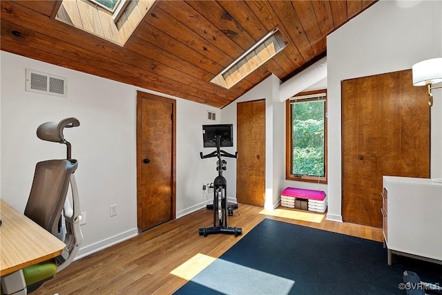 13700 Harbourwood Rd, Midlothian, VA 23112 - exercise area with a skylight, lofted ceiling, wood ceiling, wood finished floors, and baseboards