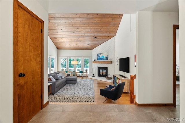 13700 Harbourwood Rd, Midlothian, VA 23112 - living area with vaulted ceiling, wood ceiling, tile patterned flooring, a fireplace, and baseboards