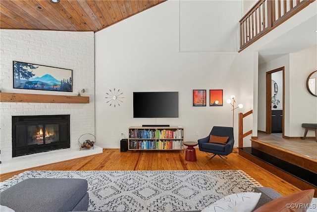 13700 Harbourwood Rd, Midlothian, VA 23112 - living area featuring wood-type flooring, a brick fireplace, baseboards, wooden ceiling, and high vaulted ceiling