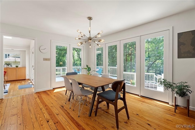 13700 Harbourwood Rd, Midlothian, VA 23112 - dining room featuring a chandelier and light wood-style flooring