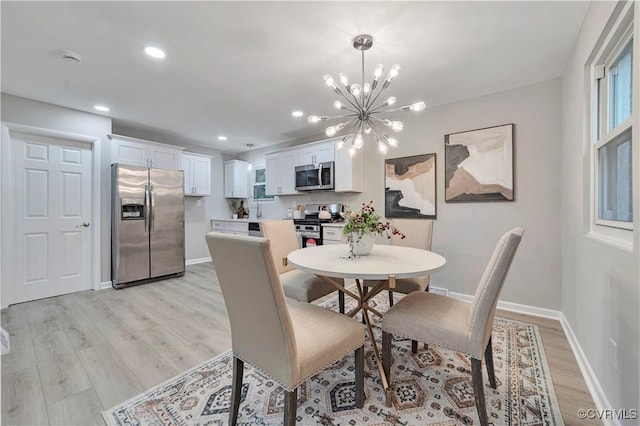 14 Gloucester Cir, Petersburg, VA 23803 - dining space featuring light wood-style flooring, a chandelier, baseboards, and recessed lighting