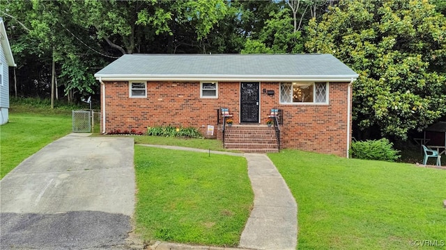 14 Gloucester Cir, Petersburg, VA 23803 - bungalow-style house featuring a front lawn and brick siding