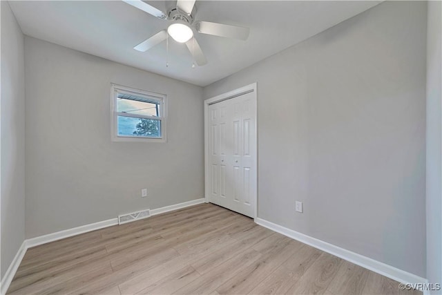 14 Gloucester Cir, Petersburg, VA 23803 - unfurnished bedroom with light wood-type flooring, a closet, baseboards, and a ceiling fan
