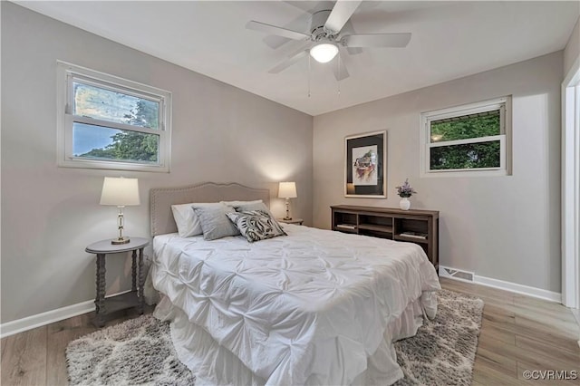 14 Gloucester Cir, Petersburg, VA 23803 - bedroom featuring multiple windows, baseboards, and light wood-style floors