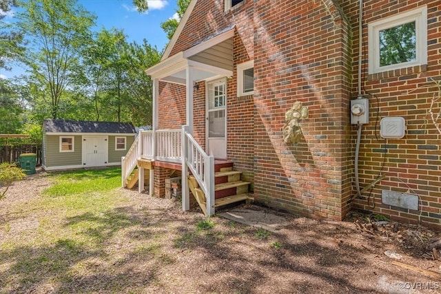 property entrance with brick siding and crawl space