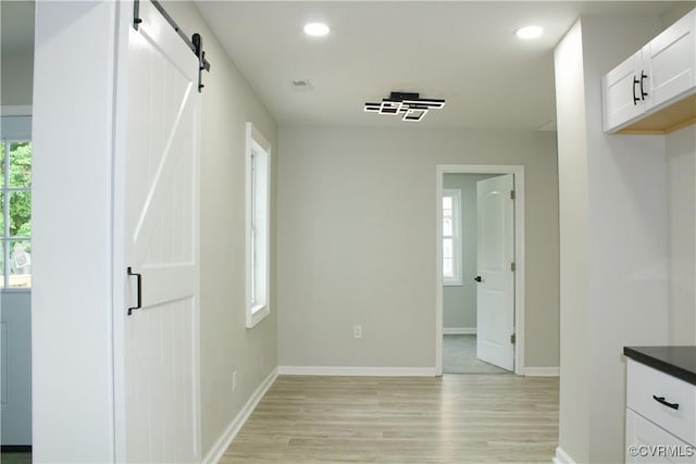 25 N Foley St, Petersburg, VA 23803 - hallway featuring light wood finished floors, baseboards, recessed lighting, and a barn door