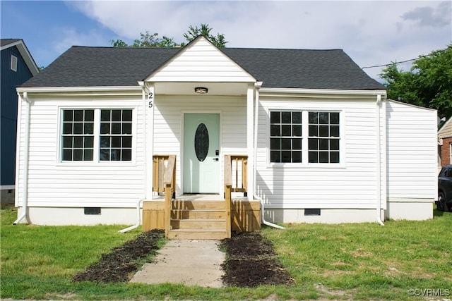 25 N Foley St, Petersburg, VA 23803 - view of front of house with crawl space, a front lawn, and roof with shingles