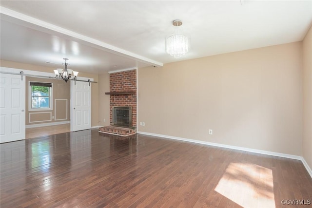 6006 Meadwood Cir, North Chesterfield, VA 23234 - unfurnished living room featuring a chandelier, a barn door, baseboards, wood finished floors, and a fireplace