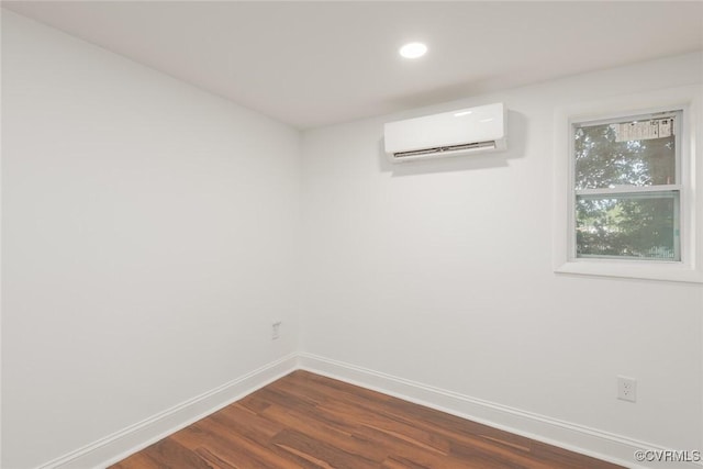 6006 Meadwood Cir, North Chesterfield, VA 23234 - unfurnished room featuring a wall unit AC, baseboards, dark wood-type flooring, and recessed lighting