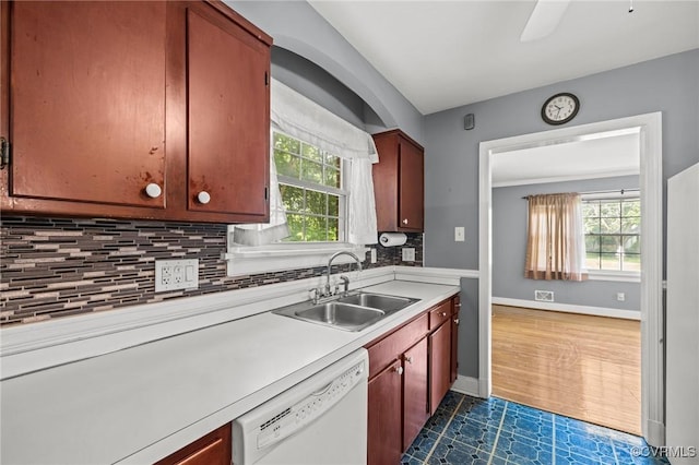 2405 Dumbarton Rd, Henrico, VA 23228 - kitchen with white dishwasher, a sink, light countertops, and plenty of natural light