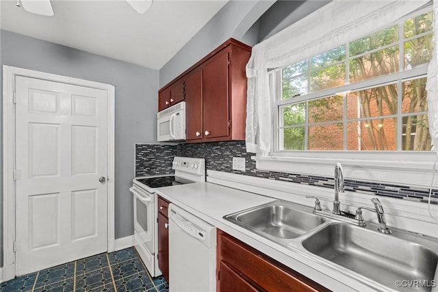 2405 Dumbarton Rd, Henrico, VA 23228 - kitchen featuring a sink, white appliances, light countertops, decorative backsplash, and dark tile patterned floors