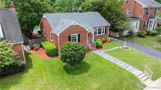 2405 Dumbarton Rd, Henrico, VA 23228 - view of front of house with brick siding, a chimney, and roof with shingles